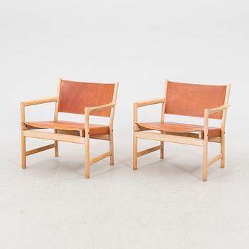 Alf Svensson, a pair of oak and leather armchairs from the second half of the 20th century.