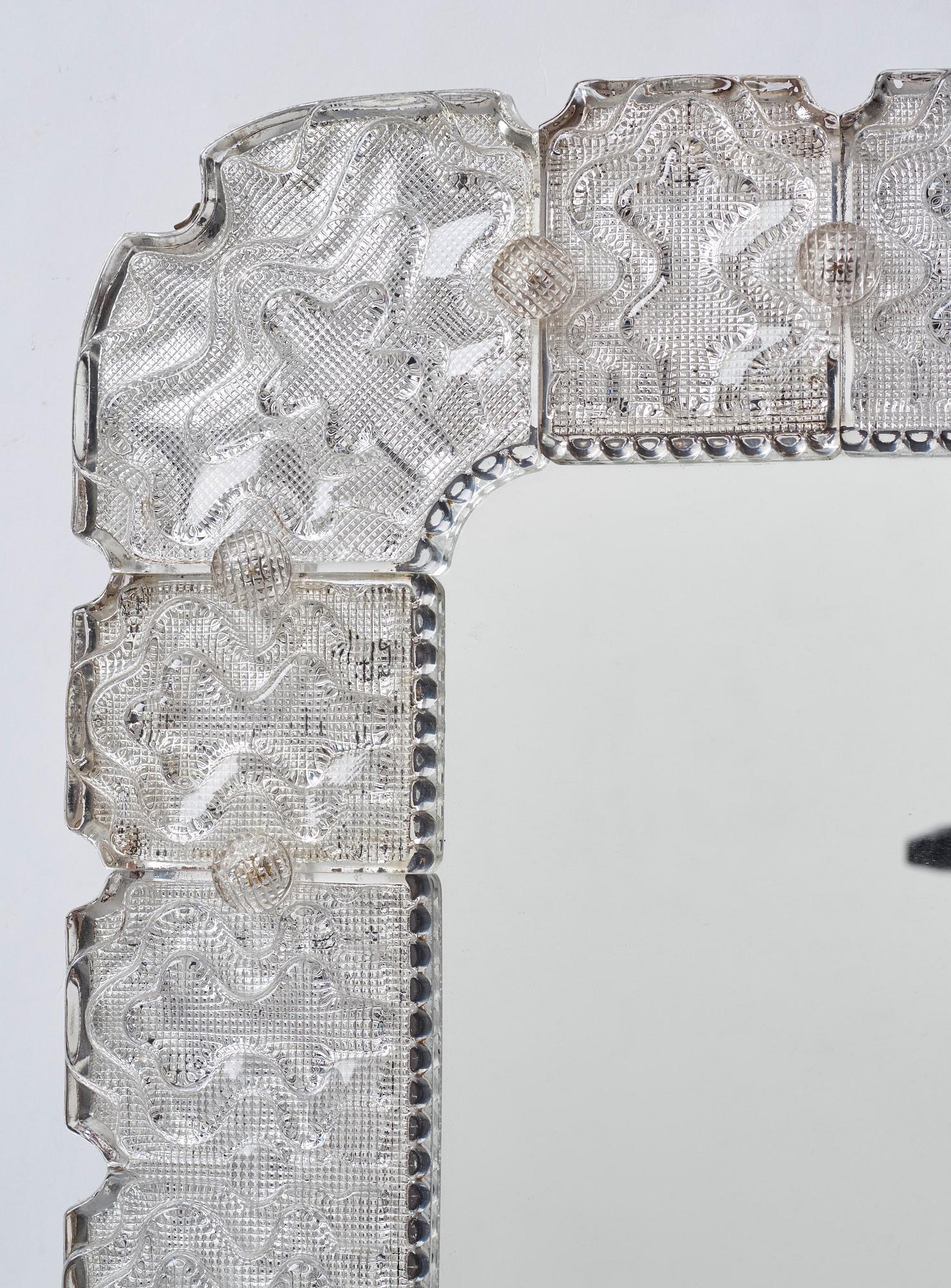Carl Fagerlund, a Swedish Modern cast glass framed mirror, Orrefors ca 1940-50's.