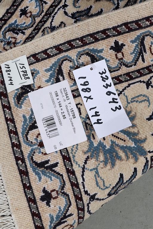 A rug, Nain, part silk, ca 198 x 144 cm.