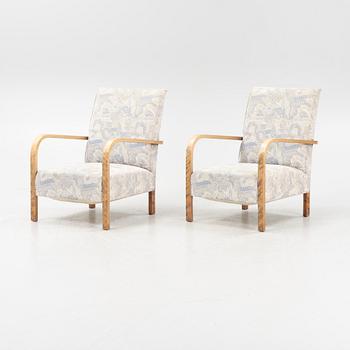 A pair of 1930's armchairs.