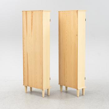 A pair of Gustavian style book cabinets, 21st century.