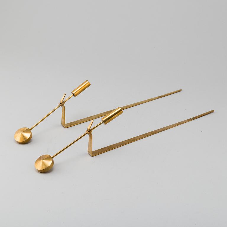 PIERRE FORSSELL, "Pendeln", a pair, brass, Skultuna. Second half of the 20th century.