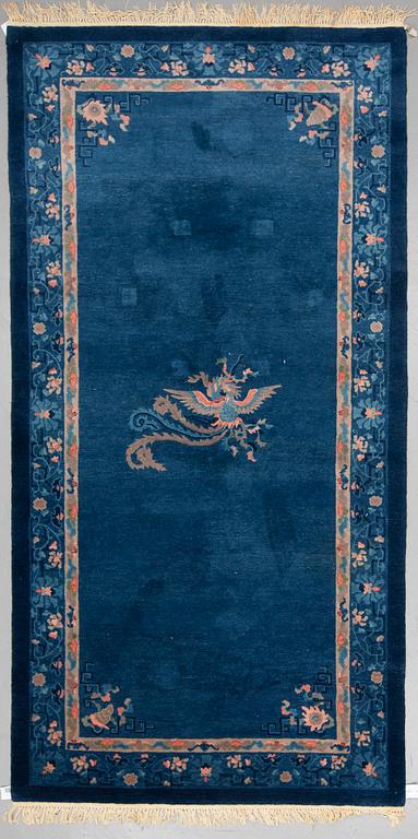 A CARPET, an old China, ca 295 x 153 cm (as well as 2 cm flat weave at the ends).