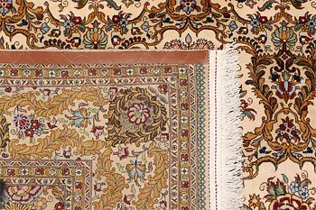 A part silk Ghom carpet, c. 420 x 310 cm.