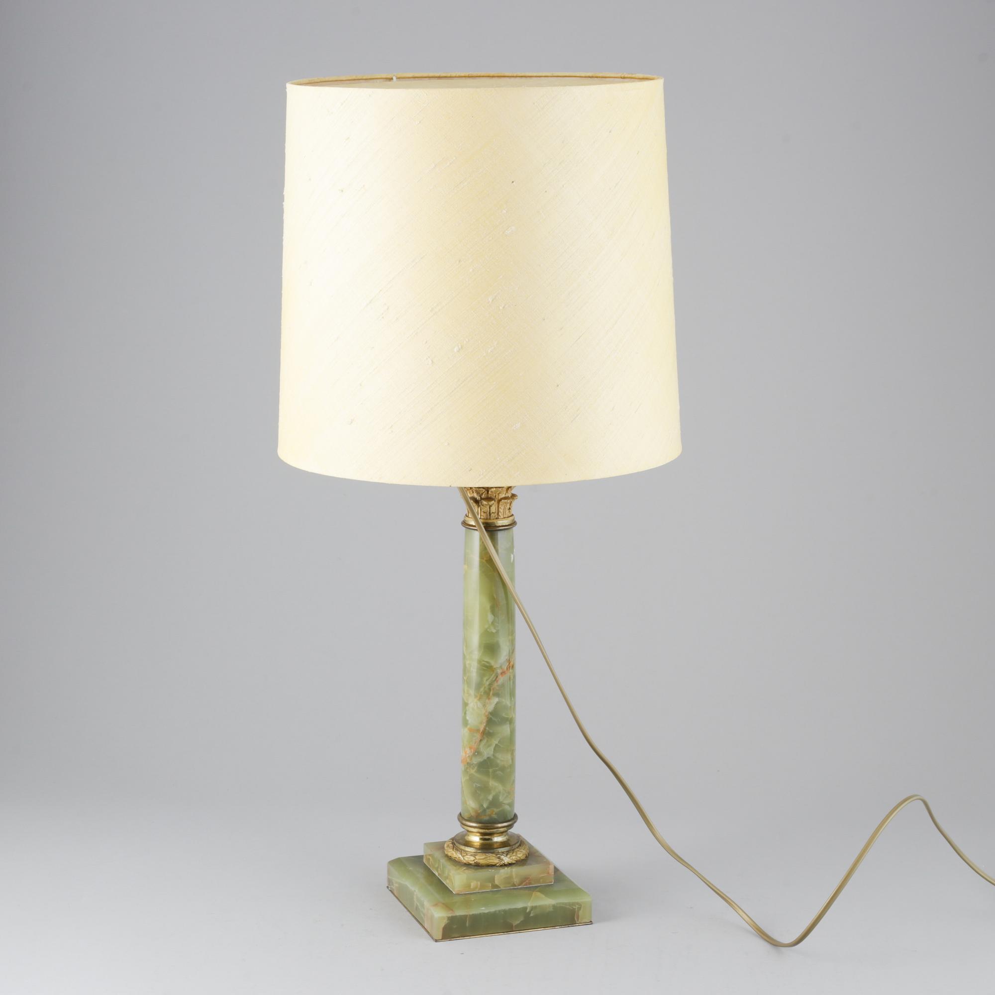 A 20th century empire style table lamp.