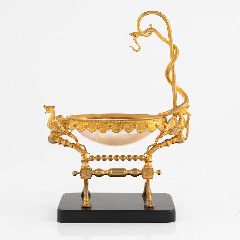 A gilt-brass, mother of pearl and diabase pocket-watch stand, late 19th century.