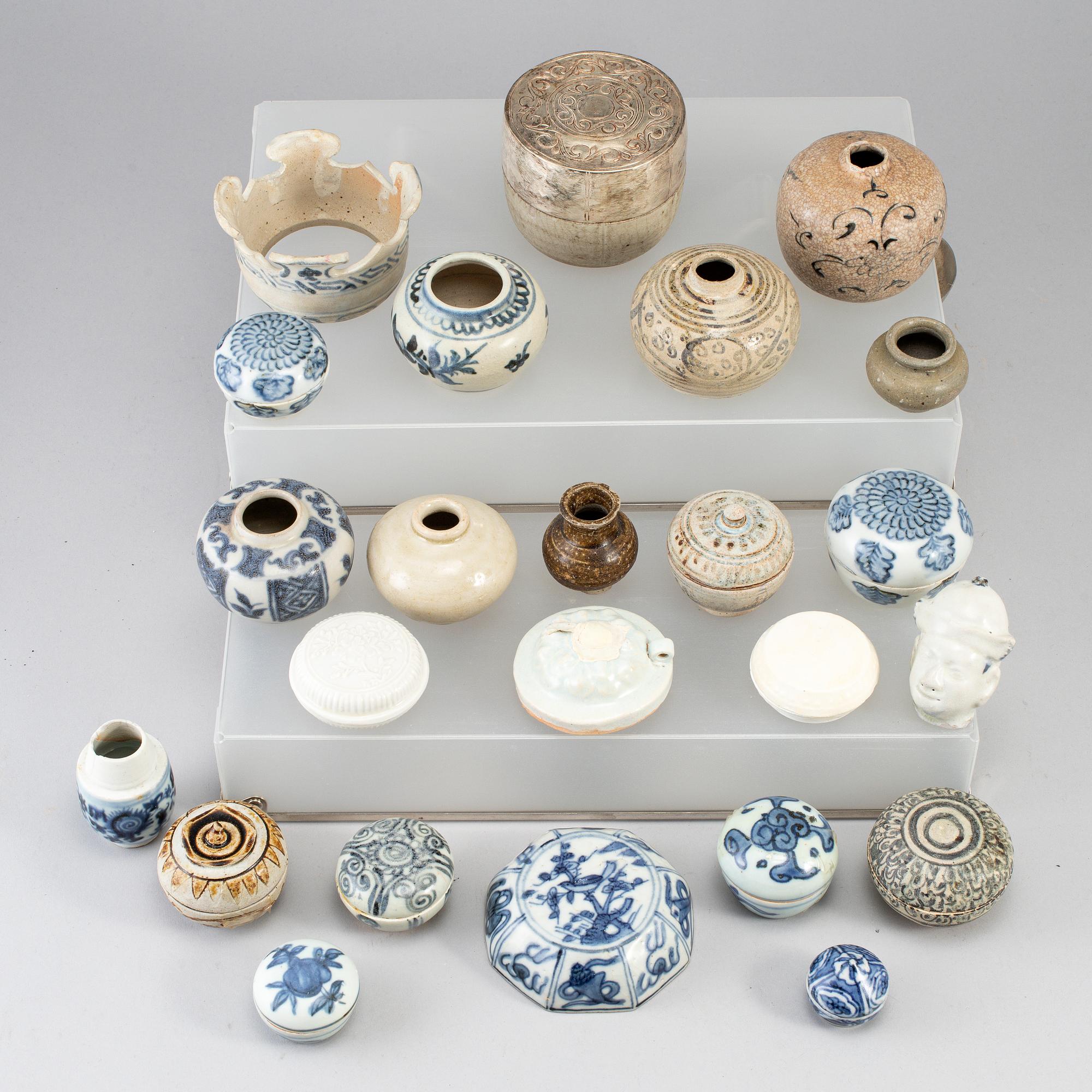 A group of 24 Southeast asian ceramic jars and boxes, 18-19th century.