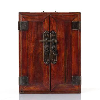 A Chinese hardwood cabinet/medicine chest, Qing dynasty/early 20th century.