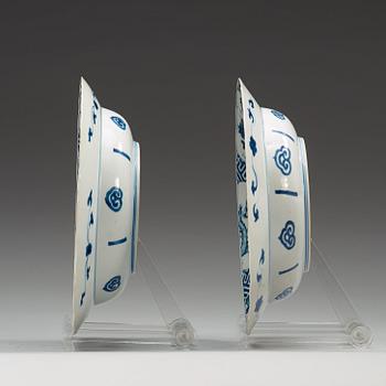 A pair of blue and white dishes, Qing dynasty, with Kangxi six character mark and period (1662-1722).