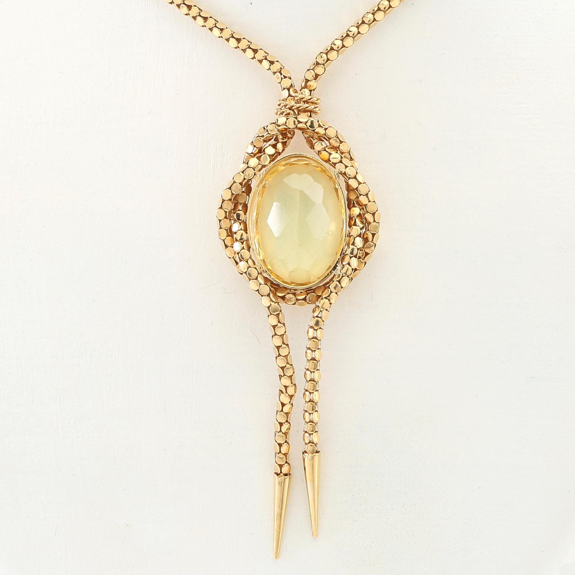 Necklace 18K gold with an oval faceted green synthetic spinel.