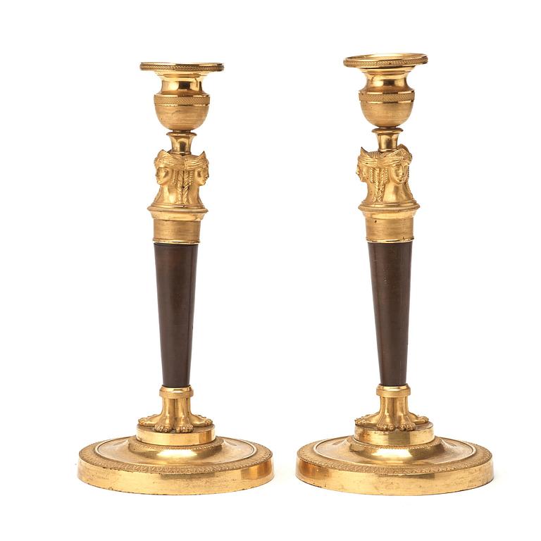 A pair of French Empire early 19th century candlesticks.