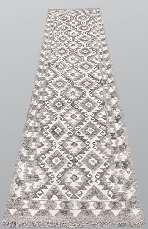 A runner, kilim, ca 298 x 84 cm.