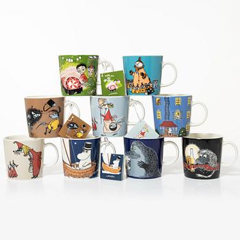 A set of 31 Moomin mugs, Arabia, Finland.