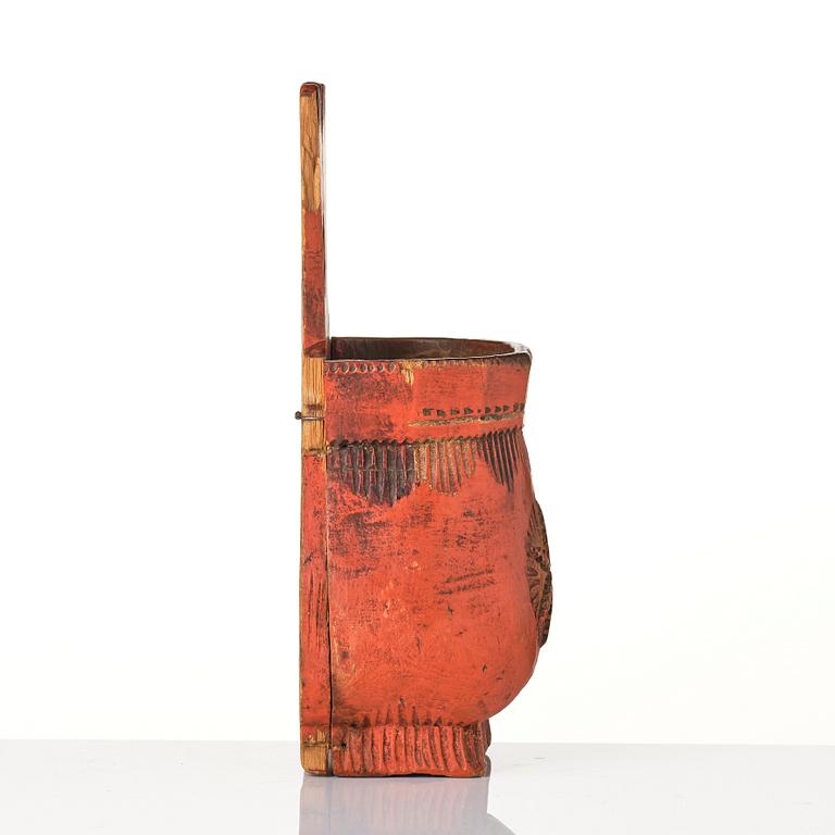 A Swedish folk art carved and painted spoon holder, 18th century.
