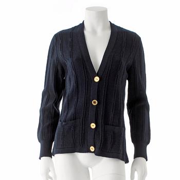 CÉLINE, a dark blue wool cardigan.