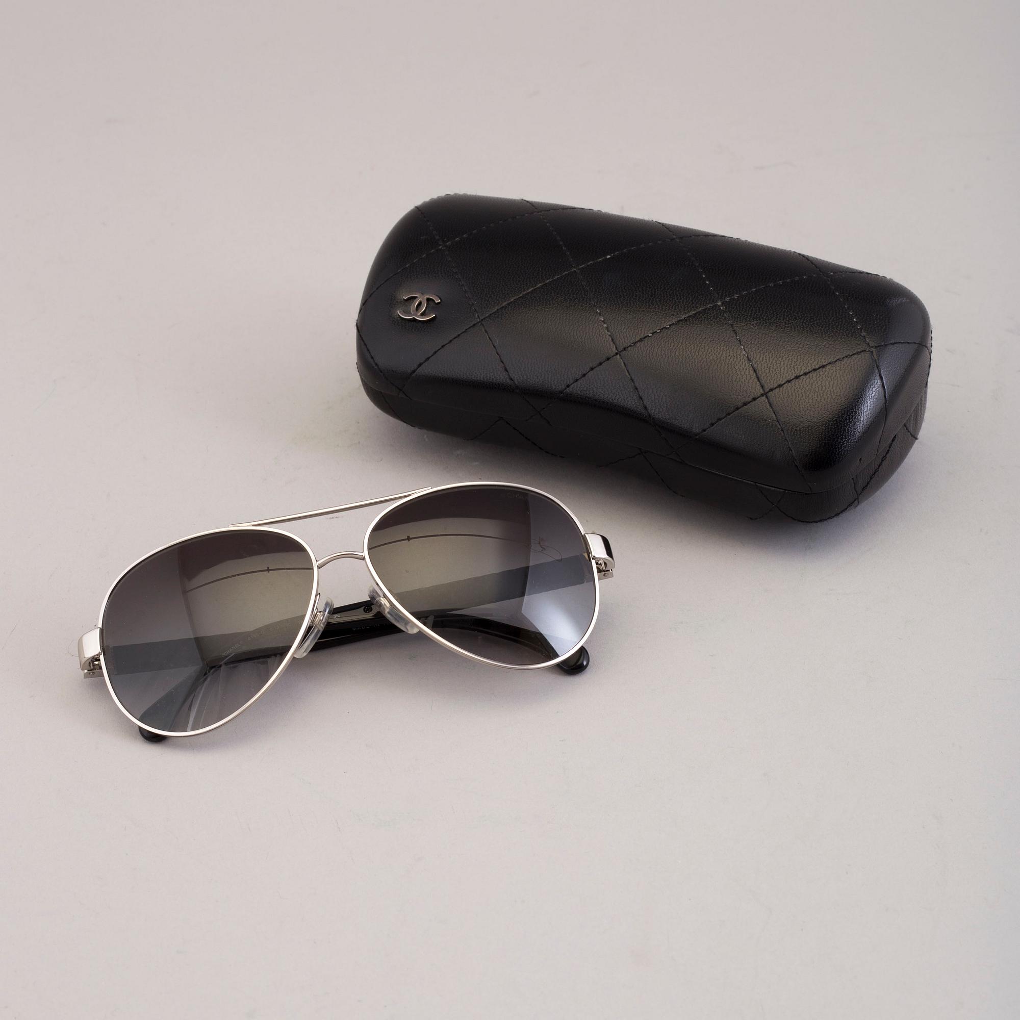Chanel black pilot summer glasses.
