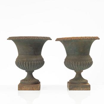 Garden urns, a pair, cast iron, marked No 15, 20th Century.