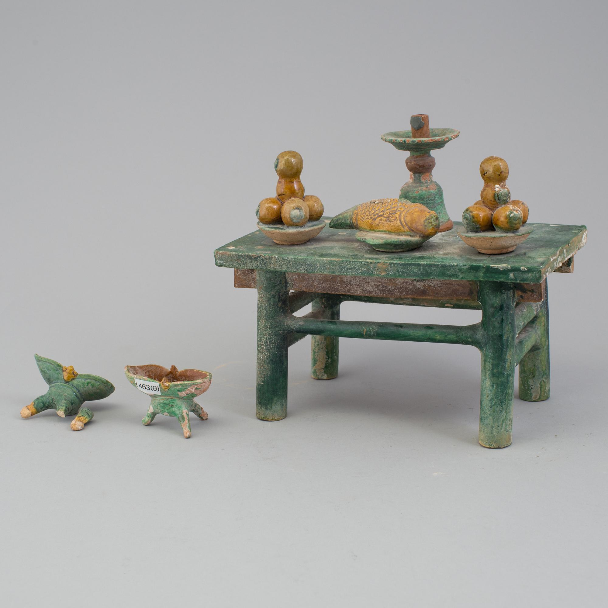 A group of eight chinese figures with three objects, earthenware, Ming dynasty.