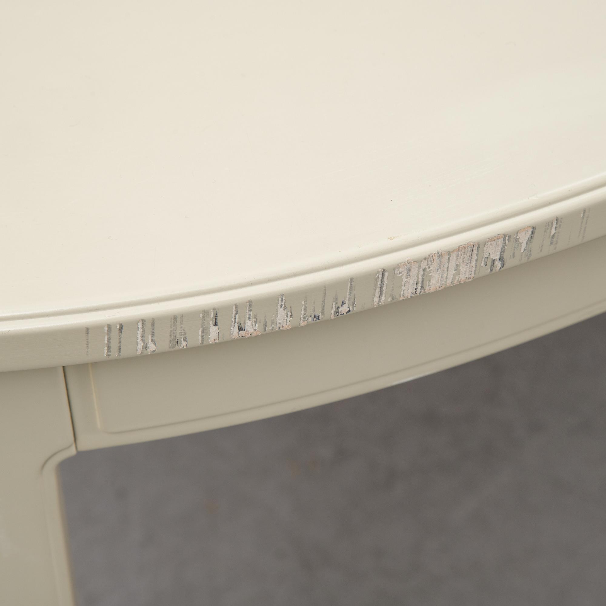 A dining table with two armchairs and six chairs by Carl Malmsten for Bodafors.