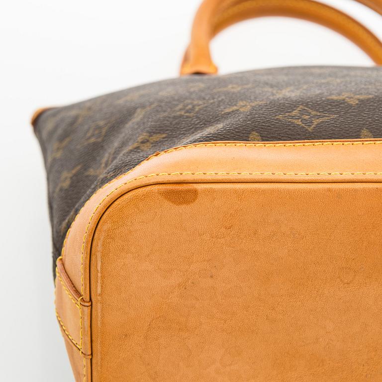 Louis Vuitton, a 'Lockit PM' bag.