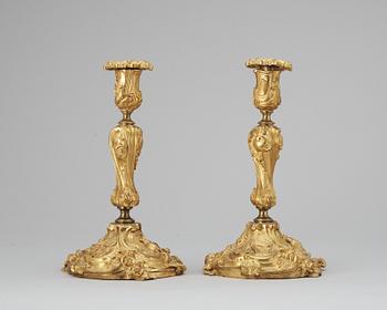 610. A pair of late 19th cent candelsticks.