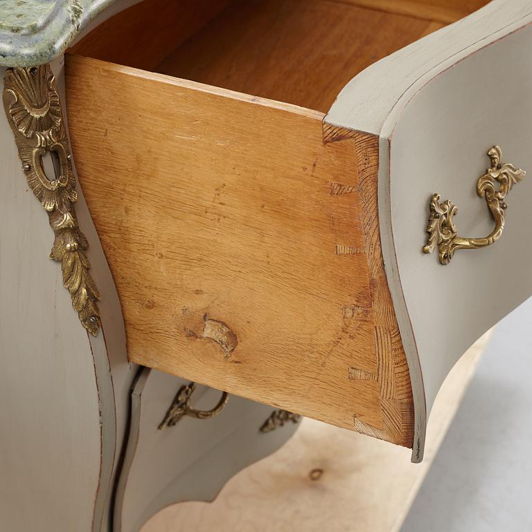 A mid 20th century rococo-style chest of drawers.