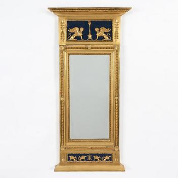 An Empire mirror, first half of the 19th Century.