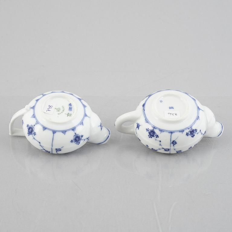 Two 'Musselmalet' porcelain creamers, Royal Copenhagen, one model 55, 19th century.