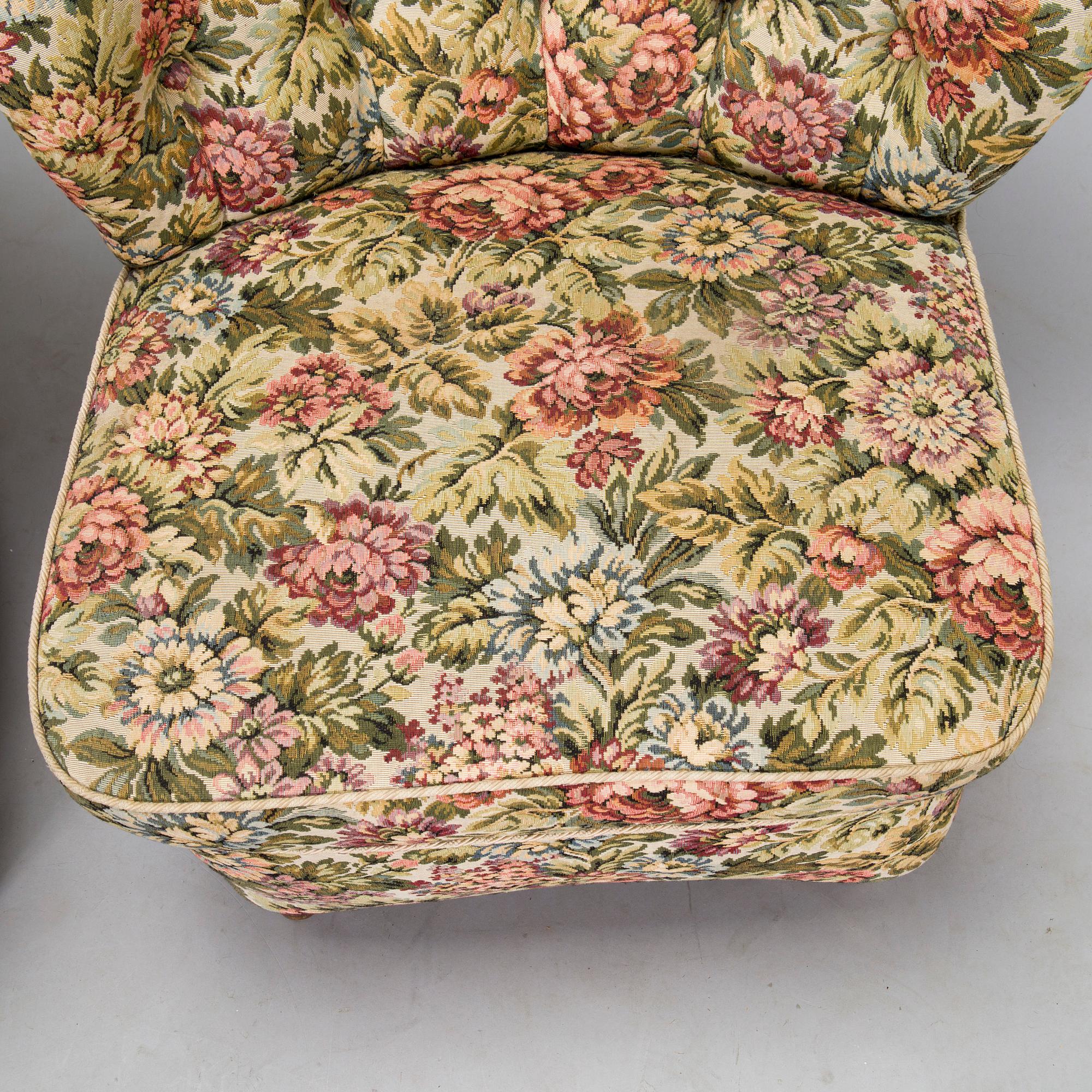 A pair of mid-20th-century armchairs.