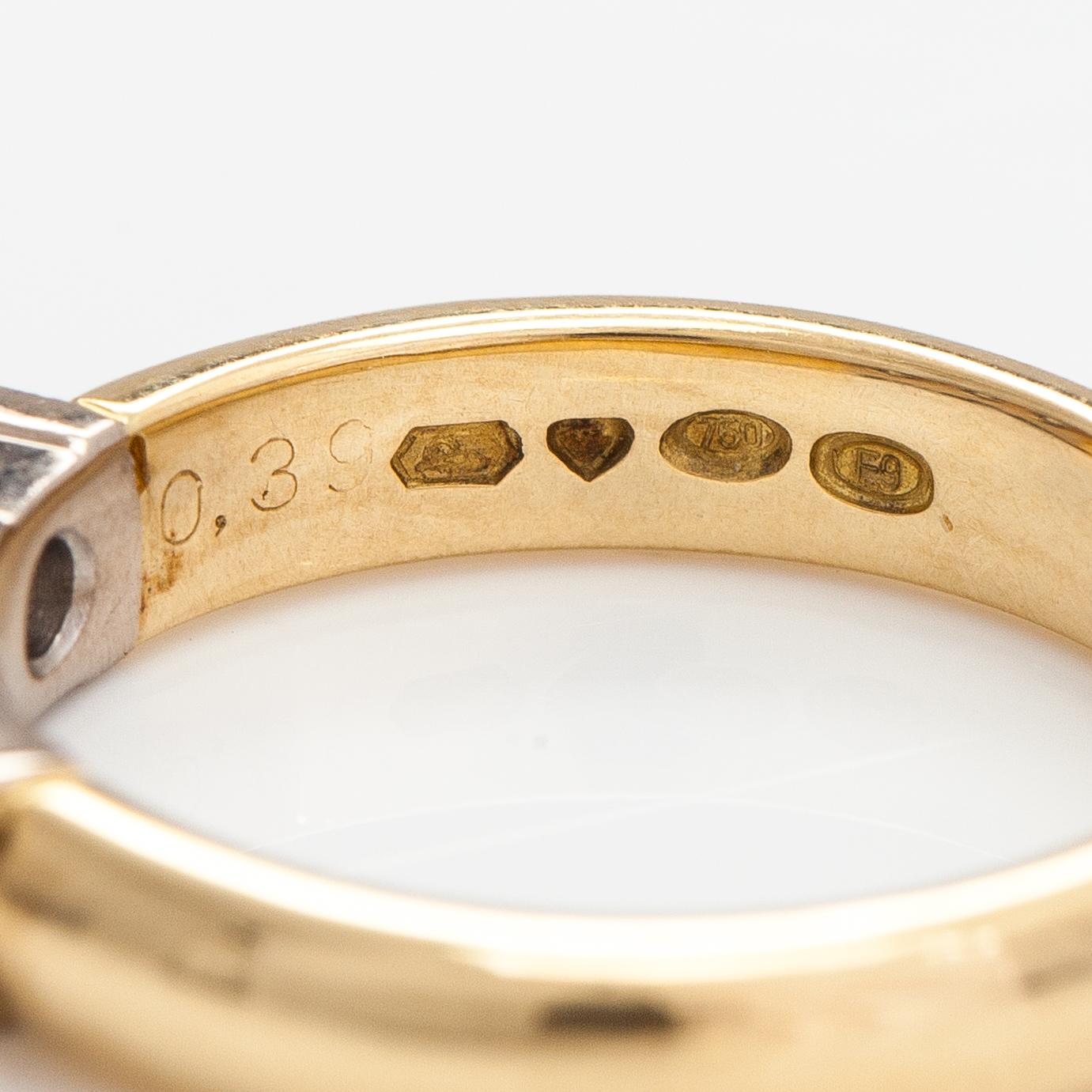 Sormus, 18K kultaa, princesshiottuja timantteja n. 0.39 ct yht. Kultakeskus, Tampere 2007.