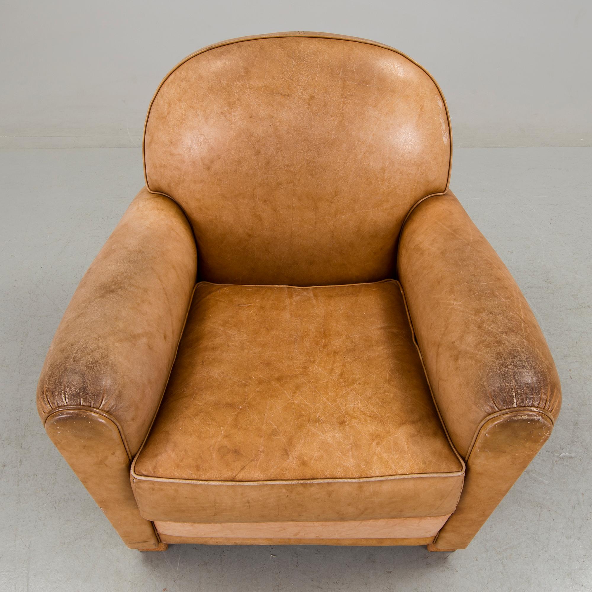 A brown leather armchair by grange, the second half of the 20th century.