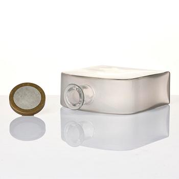Firma Svenskt Tenn, a glass bottle model A 1608, with a pewter and brass stopper by Björn Trägårdh, Stockholm, 1930s.