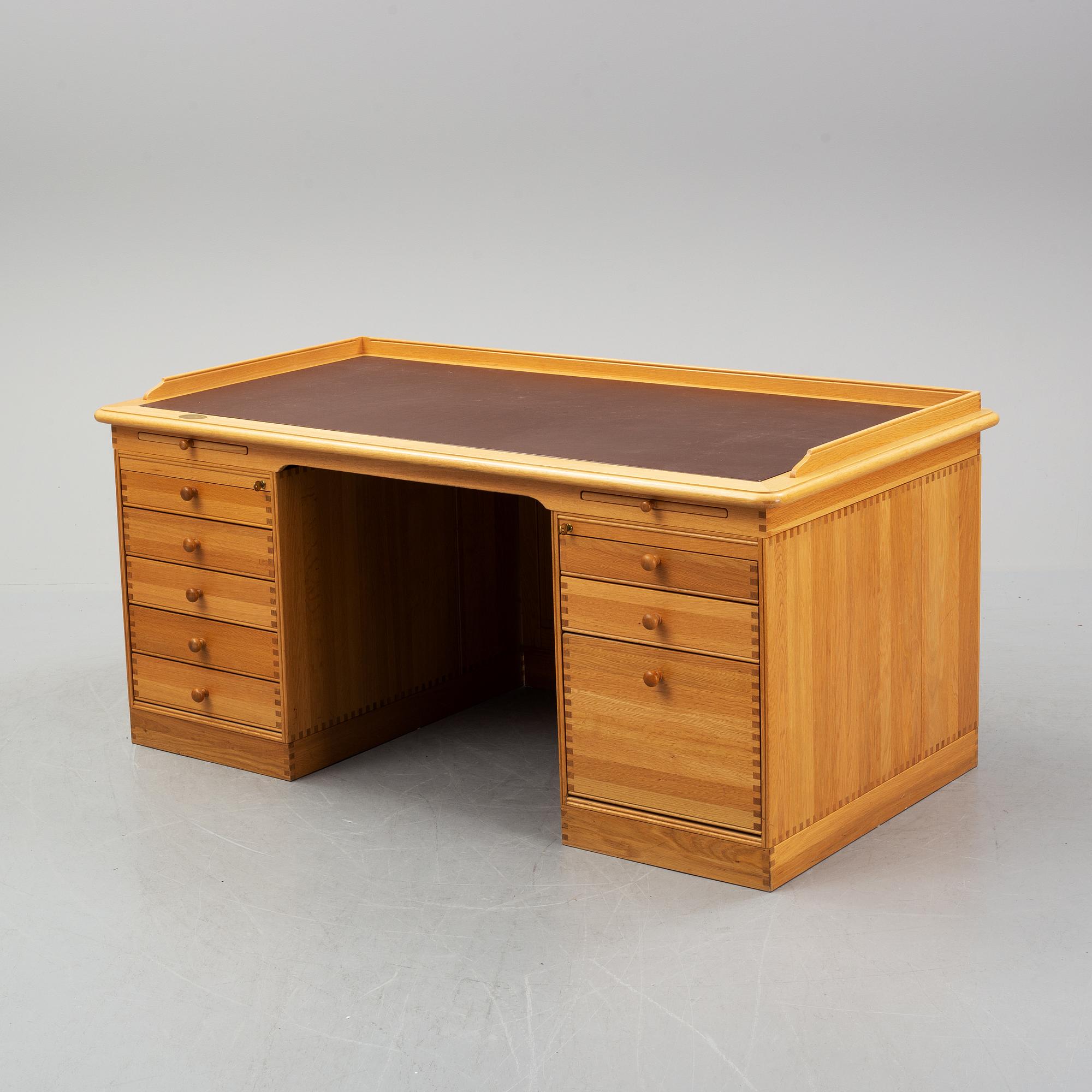 An oak writing desk by Finn N Hansen. End of the 20th Century.