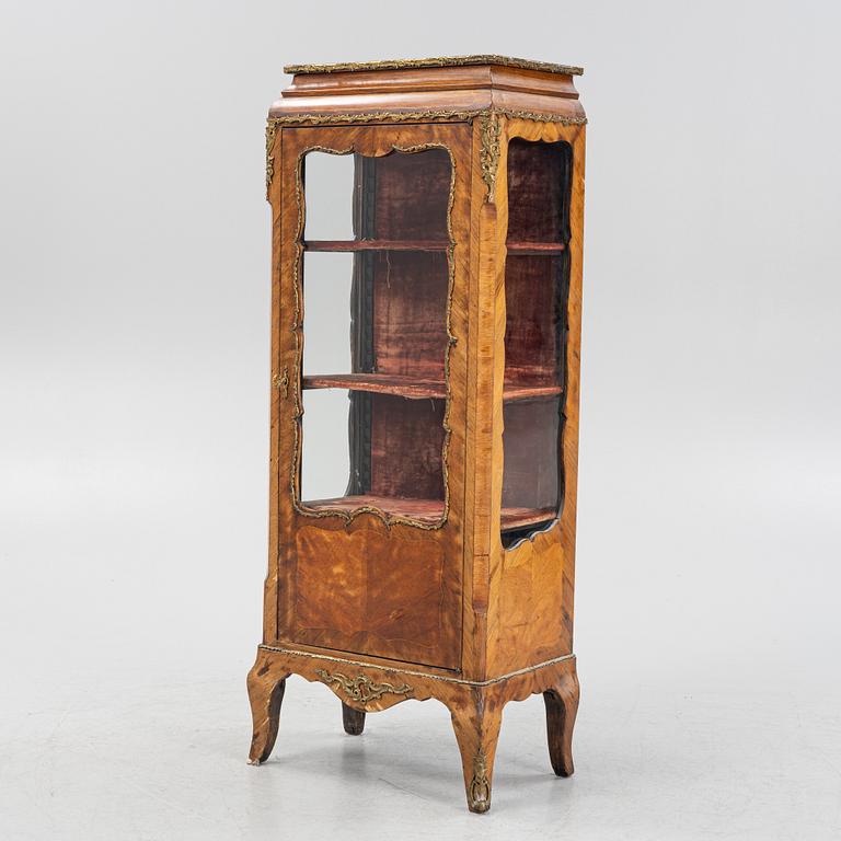 A 19th century, Rococo style display cabinet.