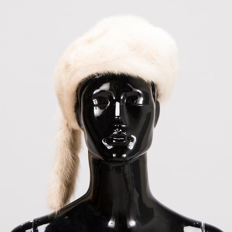 A Long White Mink Coat with a Hat by Osman Ali Finland.