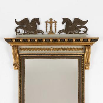 A Empire style mirror, late 19th Century.