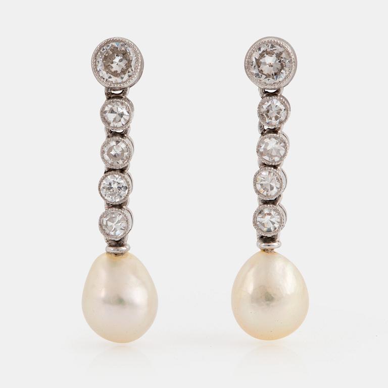 A pair of platinum and 18K white gold earrings set with pearls and old- and eight-cut diamonds.