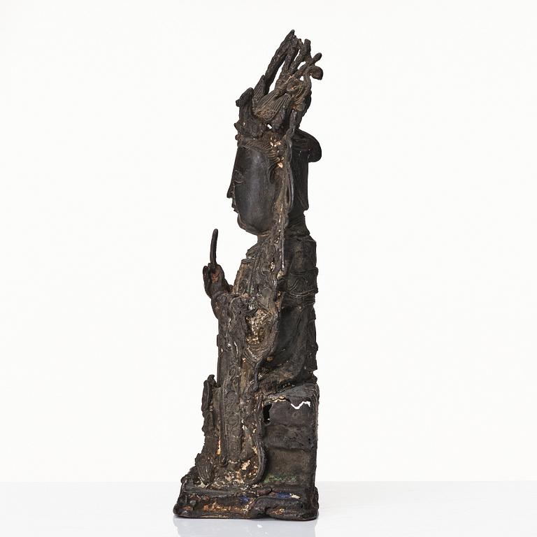 A bronze scultpure of Guanyin, Ming dynasty (1368-1644).
