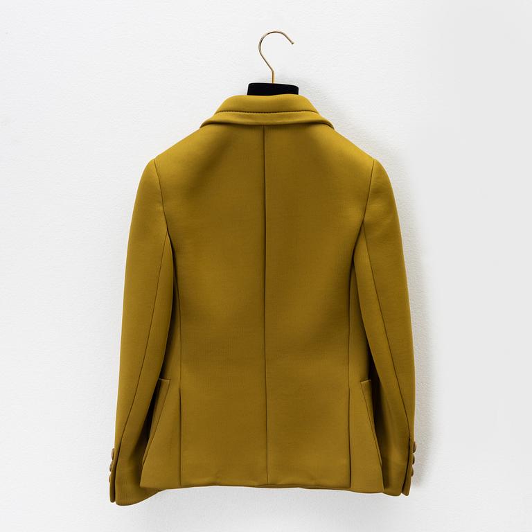 Prada, an olive green scuba jacket.