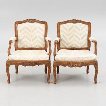 A pair of French Louis XV fauteuils, mid 18th century.