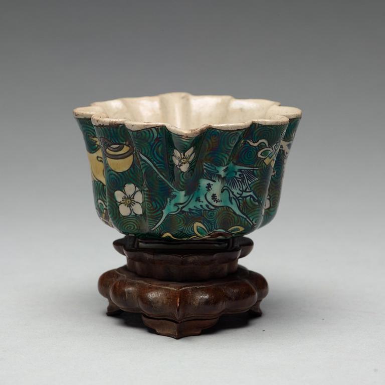 A famille verte bisquit cup, Qing dynasty, 17th century.