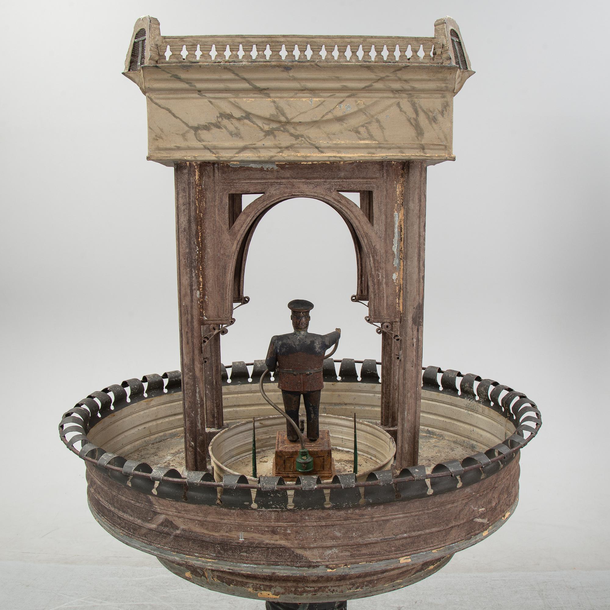 A painted and richly decorated plate garden fountain, late 19th century.
