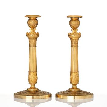 A pair of French Empire candlesticks, early 19th century.