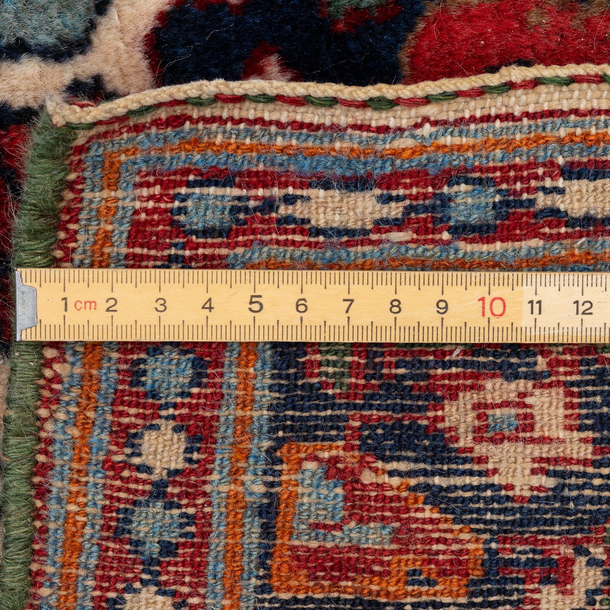 An Old Northwest Persian rug, c. 127 x 125 cm.