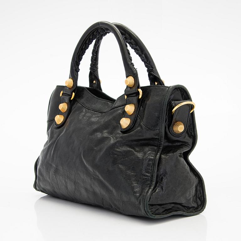 Balenciaga, a black leather 'City' handbag.