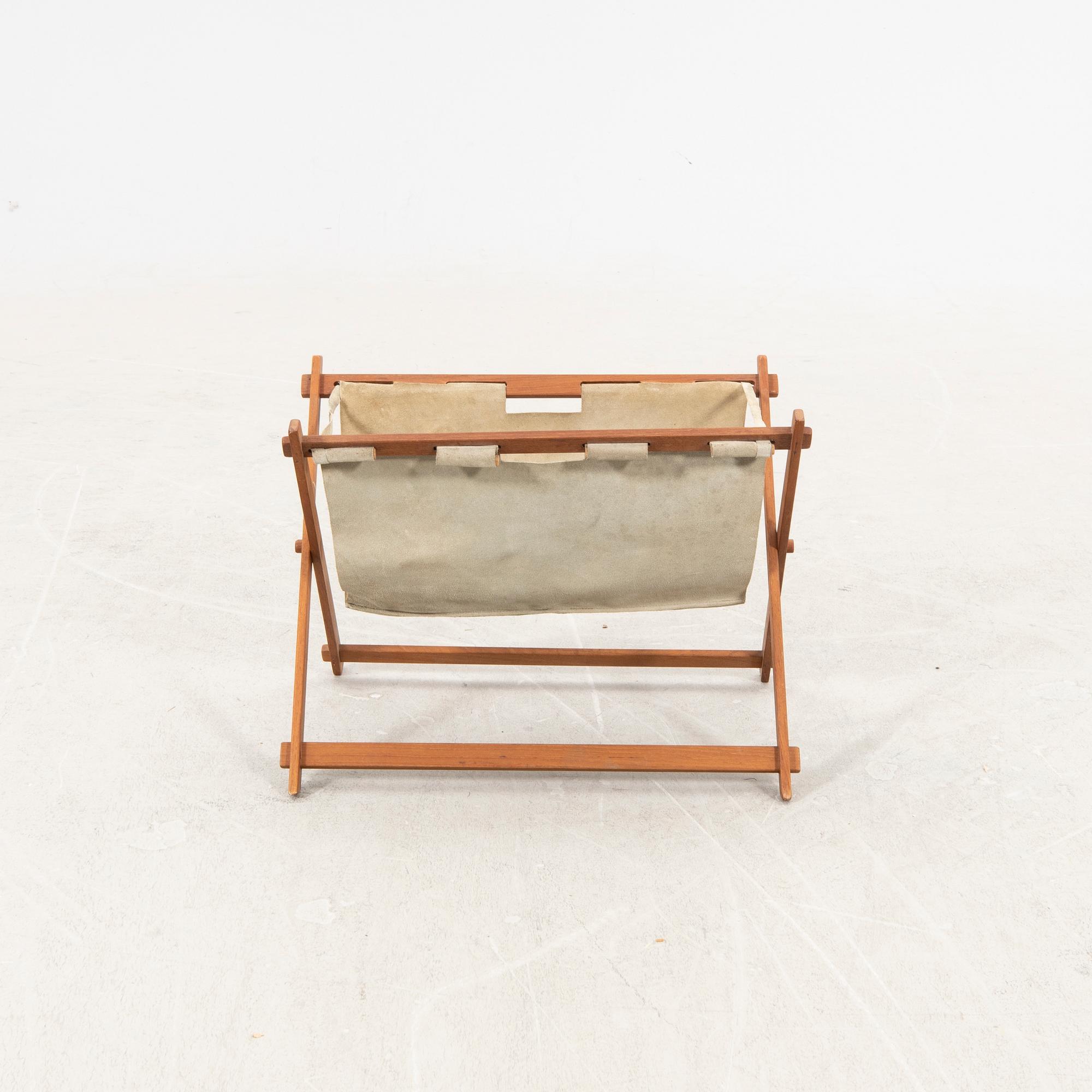A 1950/60s teak newspaper holder.