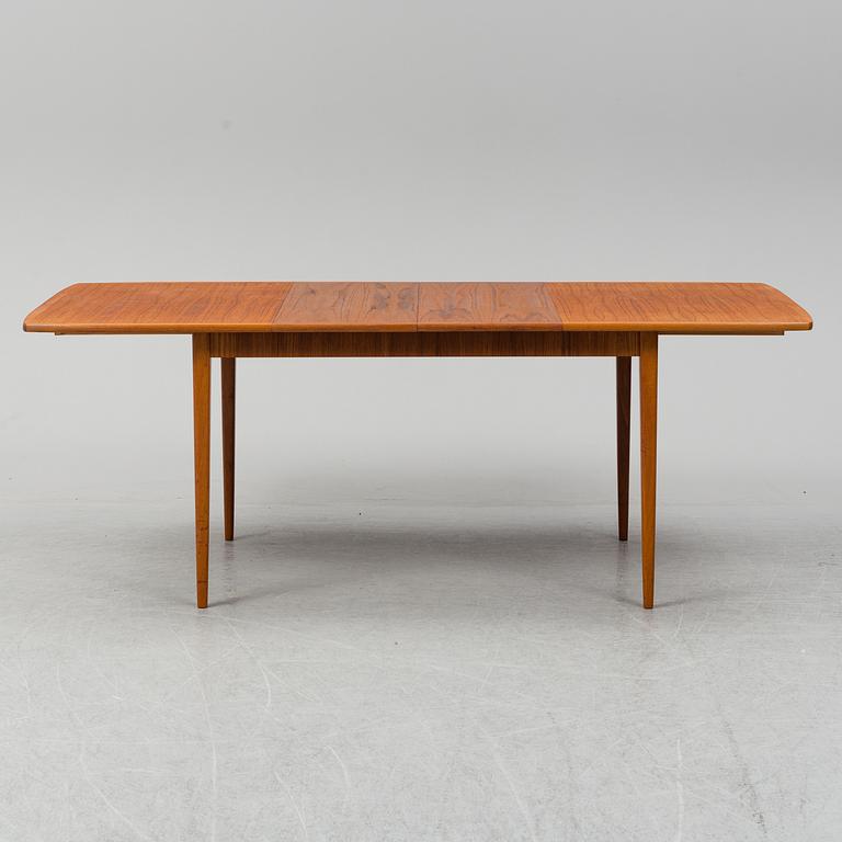 A second half of the 20th century teak veneered dining table.