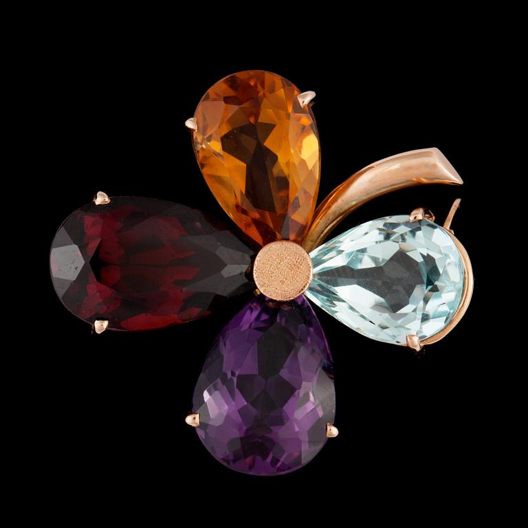 An aquamarine, amethyst, citrine and garnet brooch.