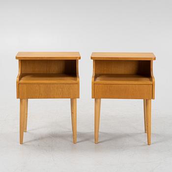 A pair of oak veneered bedside tables, mid 20th Century.