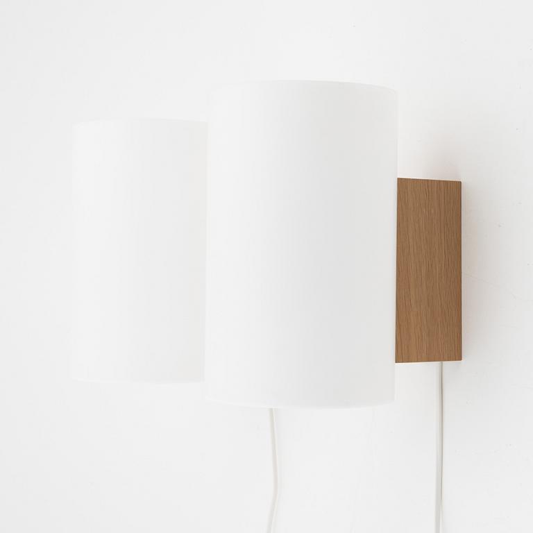 A pair of oak and acrylic wall lights, Luxus, Vittsjö.